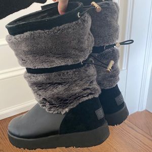 Black leather Uggs with fur on outside and inside